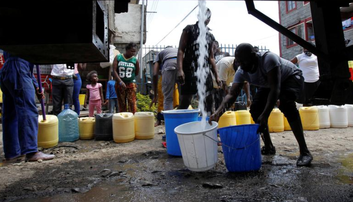 A file image of people fetching water.